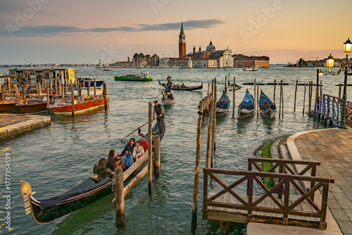 The photograph depicts St Mark's Square (Piazza San Marco) in Venice. Dominating the square is the bell tower (Campanile di San Marco)