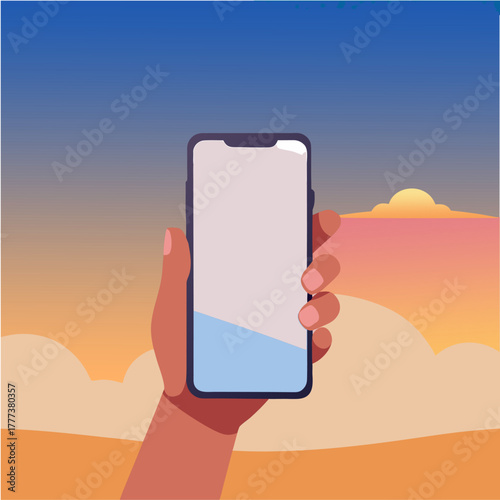 “Hand holding smartphone at sunset”