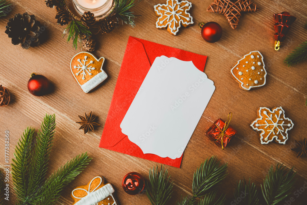 Obraz premium Christmas cookies greeting card invitation template on rustic wood with pine needles and ornaments