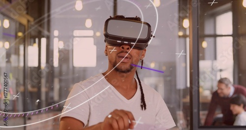 Navigating augmented reality developer wearing VR headset in coworking space with sticky notes