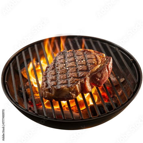 Juicy ribeye steak grilling over open flames on a charcoal grill [Transparent Background PNG]