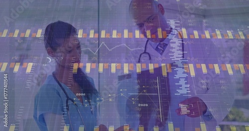 Examining nurse and doctor analyzing data in corridor, with stethoscopes, clipboard and charts