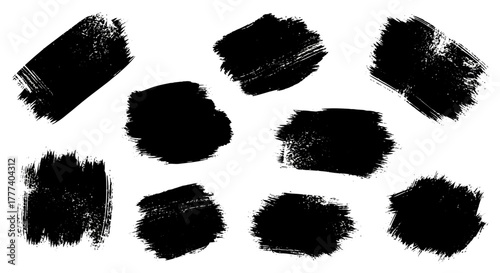 A composition of ten black brush strokes in varying shapes scattered on a white background
