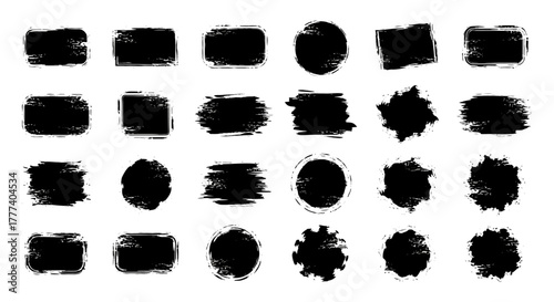 An array of grungy black paint swatches in diverse geometric forms