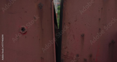 Heavy metal hatch of ship hull covers cargo safely closeup. Bulk carrier vessel equipment for containers keeping during sailing by sea