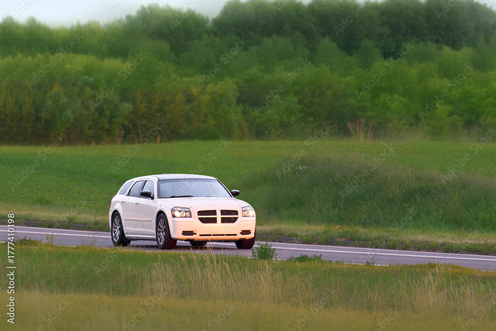 Fototapeta premium Black performance car on empty highway