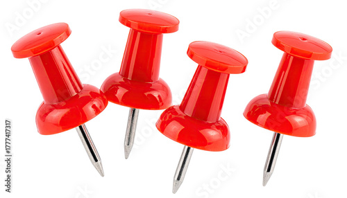 Four red pushpins with steel tips clustered on a black backdrop