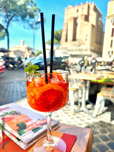 Photography Aperol Spritz cocktail served at an outdoor café in Rome, Italy