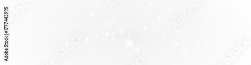 Bright glow of shiny magic dust particles floating on golden glitter background.
