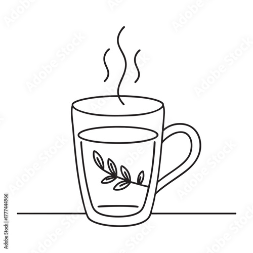 Glass cup with strong hot tea captured from a high-pour angle