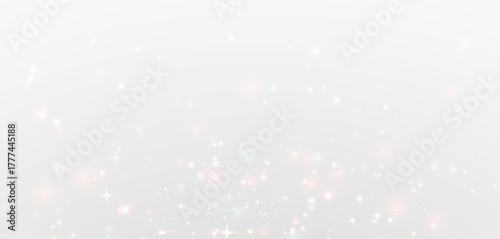 Glowing sparkle glitter magic dust trail floating softly on starlight background.
