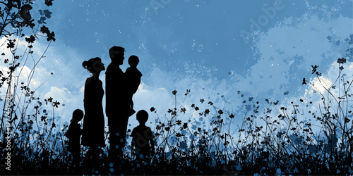 Silhouetted family with young children standing together in a field of wildflowers at dusk