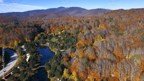 Overhead Aerial Shot Flying Over a Camping Site with Tents near a Lake and Bridge in a Fall Forest. Domanic, Kutahya - Turkey