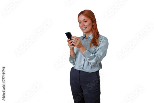 Professional woman with red hair smiling, using smartphone for texting and social media, networking on transparent background