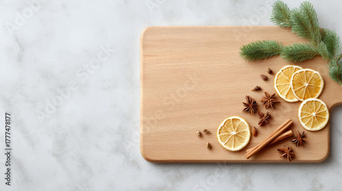 Wallpaper Mural Cozy, festive winter flat lay with wooden cutting board on marble background. Dried orange slice, cinnamon stick, and star anise spice create warm, aromatic holiday scene Torontodigital.ca