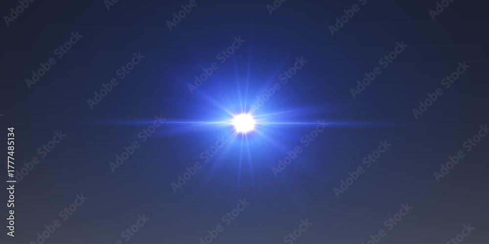 Obraz premium Blue light flare with shining rays on dark background