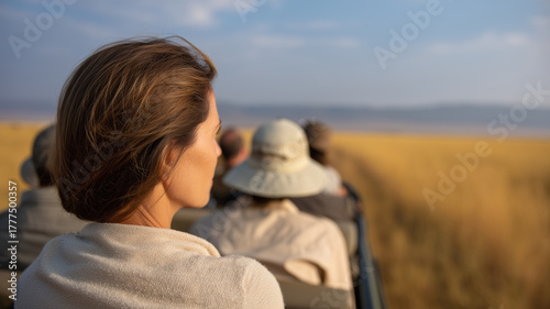 Woman safari wildlife adventure travel nature outdoor grassland vehicle tourism Observing wildlife safari adventure woman enjoys natural beauty and golden grasslands from open vehicle feeling