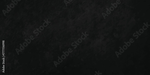 Grunge black rock limestone marble surface cement wall concrete paper backdrop background. Rough blackboard aged nature retro granite structure texture.
