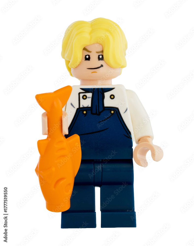 Obraz premium Dortmund - Deutschland 4. November 2025 - Lego Figur Sanji mit Fisch blickt böse der Serie One Piece - Studio Aufnahme