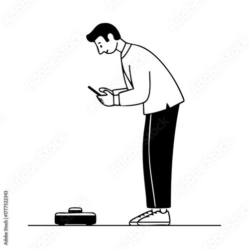 Man controlling robot vacuum cleaner from smartphone, showing smart home automation and convenient cleaning technology.