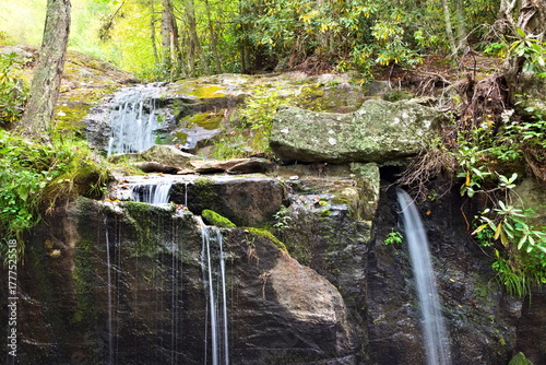 A quiet park in the Blue Ridge Mountains offers peaceful and beautiful views of a series of small cascading waterfalls.