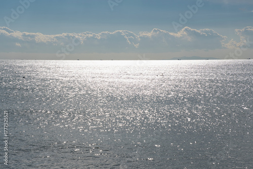 Sunlight shimmering across the calm sea