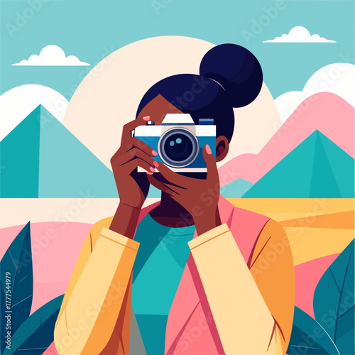 A stylish woman with a dark hair bun holding a vintage two-tone camera to her face.