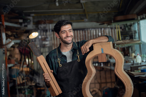 Luthier making guitar using traditional tools in workroom with manual tools