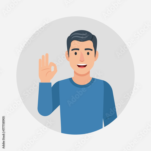 Smiling man in blue shirt showing okay gesture against a light gray circle, conveying positivity and agreement in a simple, friendly manner.