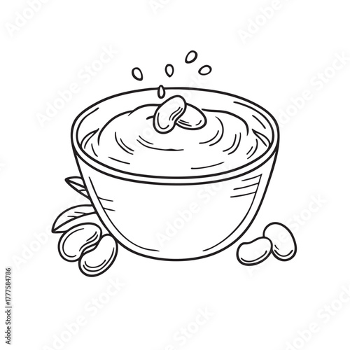 Bowl filled with velvety fava bean puree topped with olive oil