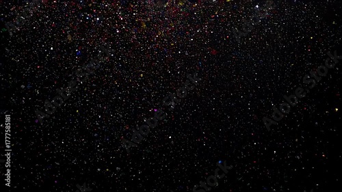 Colorful confetti falling against a black background in slow motion. Great for celebration intros, festive advertisements, party promotions, and social media videos.
