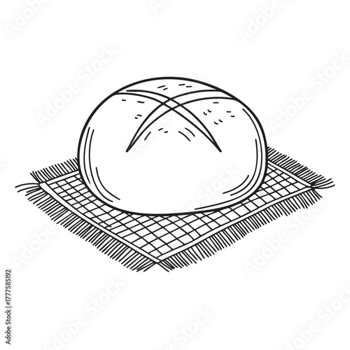 Crusty round loaf resting neatly on a woven mat