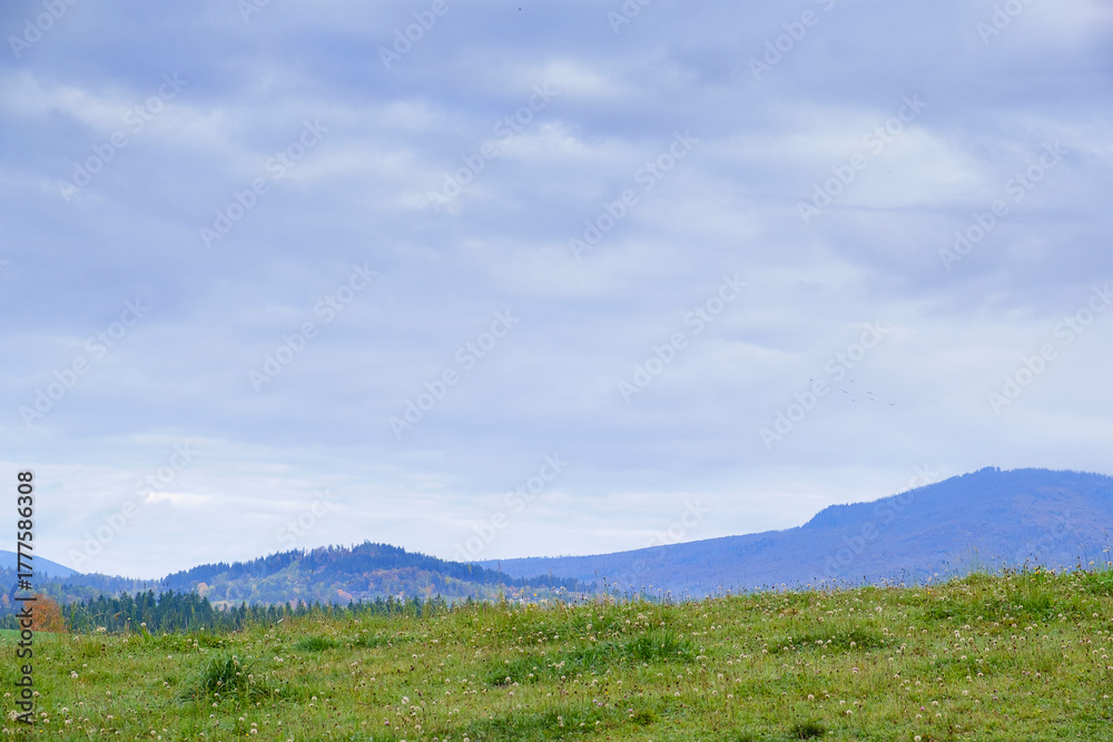 Fototapeta premium Wide landscape with mountain meadow and cloudy sky in Bavaria, Germany