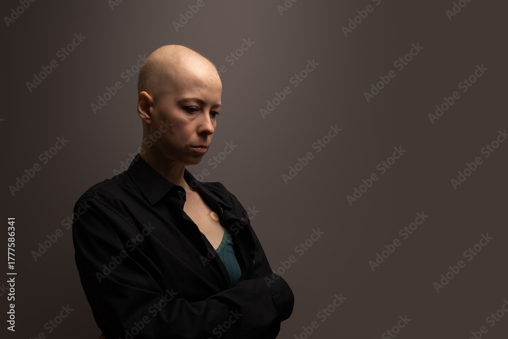 Fototapeta premium Female cancer patient suffering from anxiety and depression, symbol of psychological burden, pain, and emotional exhaustion.