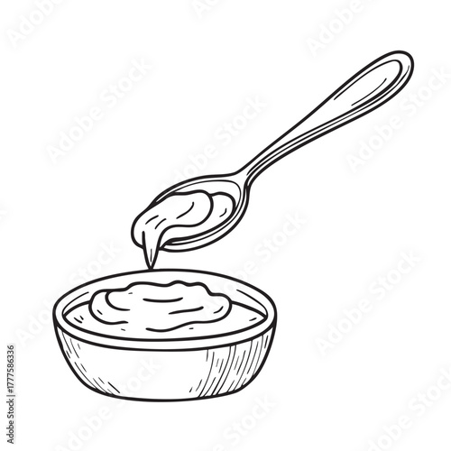 Metal spoon dipping directly into a rich red spicy paste