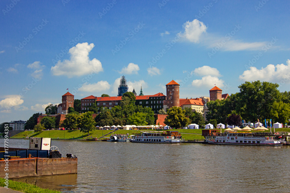 Obraz premium Riverside View of Wawel Castle in Kraków, Poland, Former Royal Residence and National Landmark
