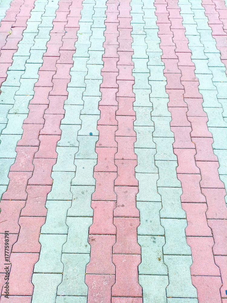 Fototapeta premium Background graphic abstraction: multi-colored street tiles in parks and squares of Odessa.