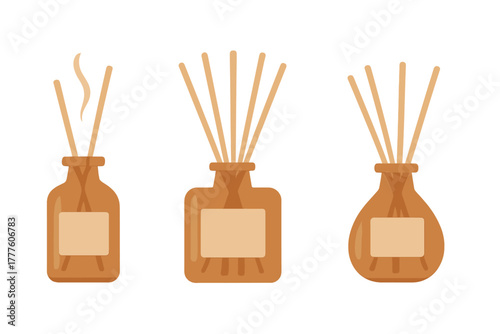 Three aroma reed diffusers in brown glass bottles with wooden sticks for home fragrance