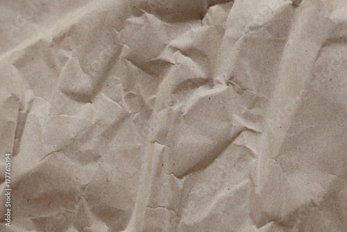 Brown crumpled recycled paper texture background. Kraft Paper