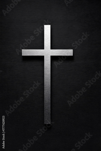 Silver cross on a dark background with a sleek design for various religious contexts
