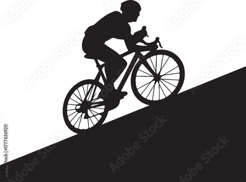 Silhouette of male cyclist on a road bike riding uphill, demonstrating effort and sport