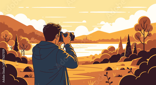 Man taking a picture of a landscape with mountains, trees, and a lake during a golden sunset hour
