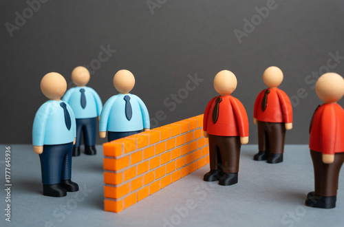Obraz na plátně A brick wall separates two ideological camps of office workers
