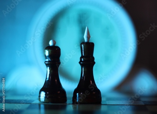 glass chess pieces king and queen on the board 