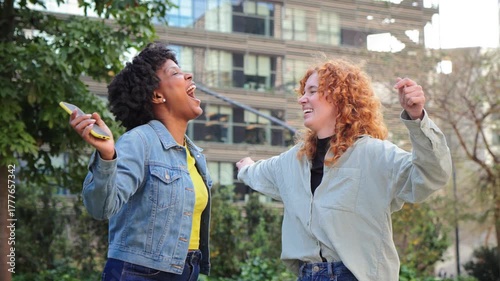 Two happy girls dancing and enjoying their favorite music together, radiating joy and excitement in a lively moment of friendship and celebration that captures pure happiness and connection.
