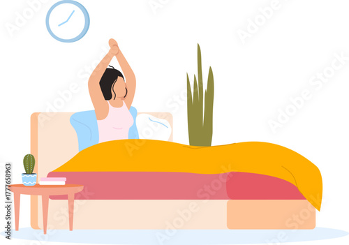 Woman waking up stretching in bed in morning