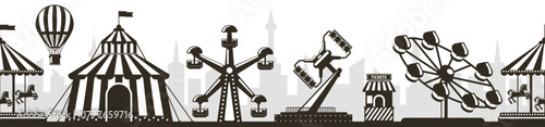 Amusement park carnival fairground rides skyline silhouette