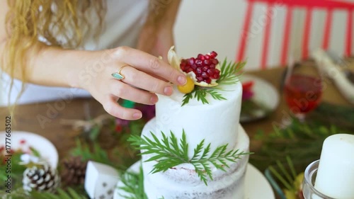 a beautiful bakery owner decorate the white cake