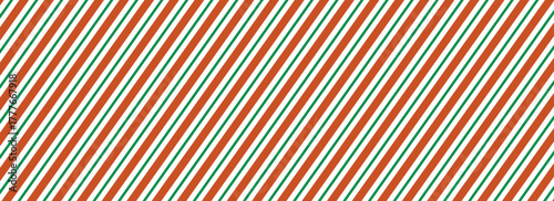 Striped candy cane Christmas seamless pattern. Red and green diagonal lines wallpaper. Winter holiday present wrapping paper. Xmas peppermint repeating background. Vector gift decoration
