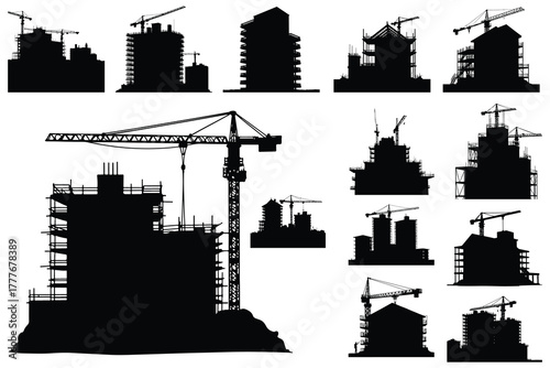 Black silhouettes of construction cranes and buildings